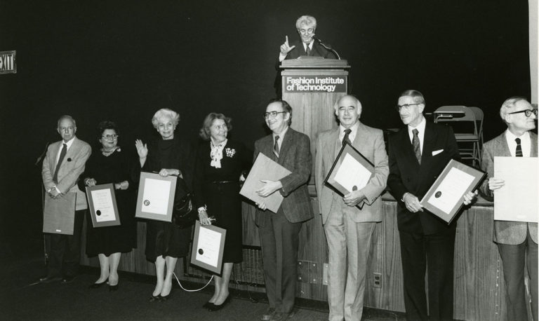  Founding administrators honored: Pictured: President Marvin Feldman (at the podium), Frank Shapiro, Rosa Balenzano, Shirley Goodman, Gladys Marcus, Albert Kresch, Bill Leader, Harry Greenberg, and David Zeiger (partially out of frame).
